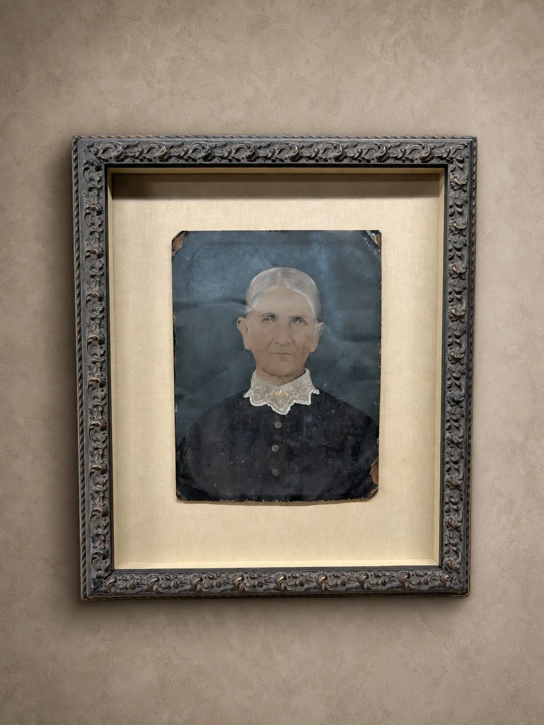 A vintage portrait float mounted in a traditional frame